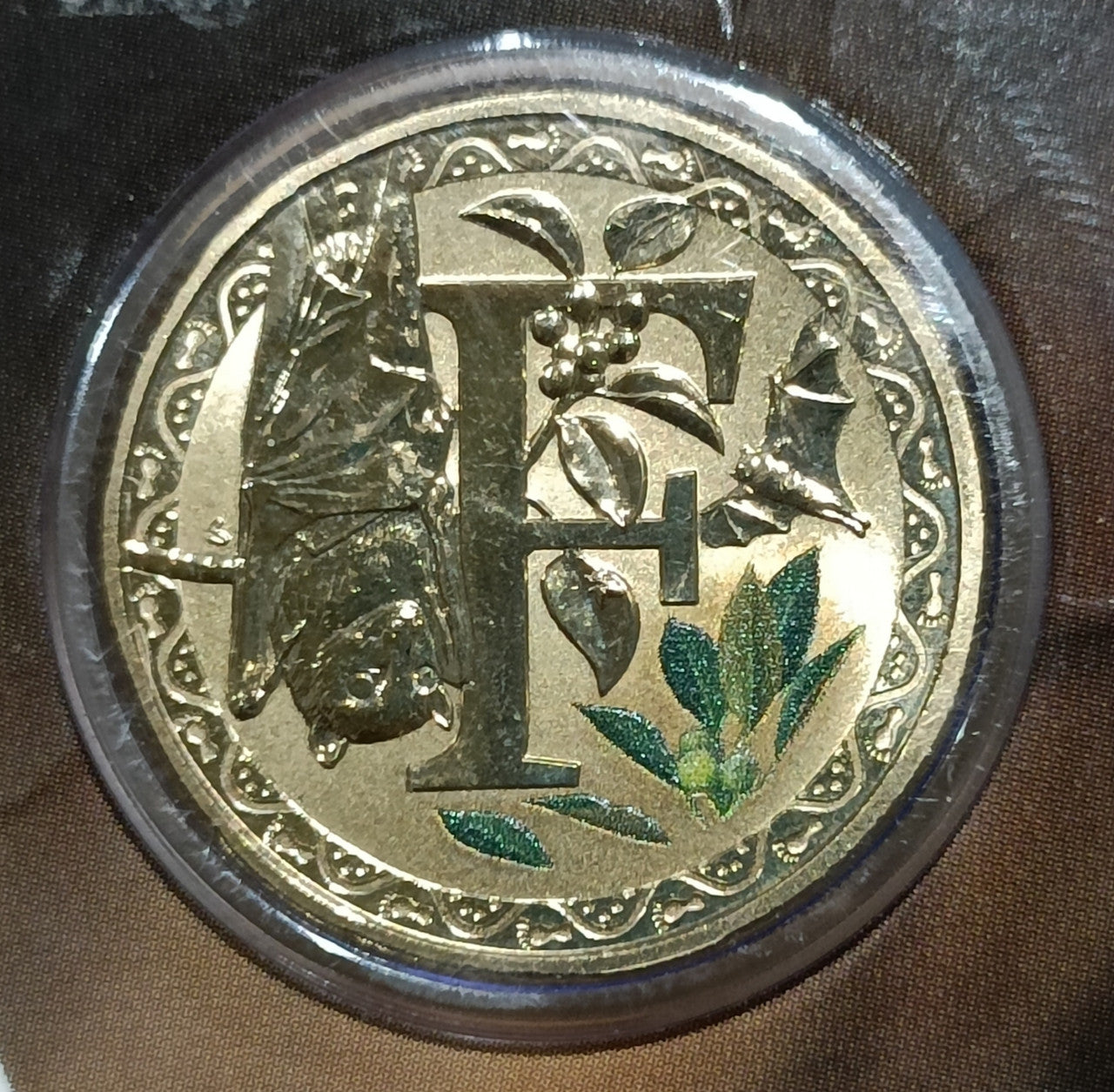2015 $1 Coloured Frosted Uncirculated Coin Letter "F"